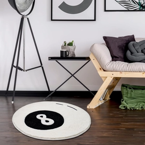 Detail of round black 8 billiard rug showing thick plush texture and durable hemmed edges