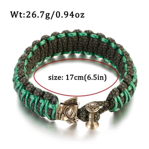 Green and brown hand-woven paracord bracelet with bronze clasp weighing 26.7g