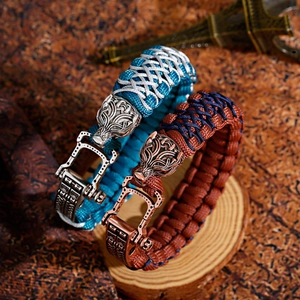 Macro shot of Viking braided paracord bracelets with adjustable metal wolf head buckles