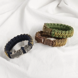 Men's braided paracord bracelet set with lion head metal clasp in navy, olive, and brown