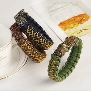 Handmade paracord bracelets with vintage skull charms in navy blue, coffee, and green