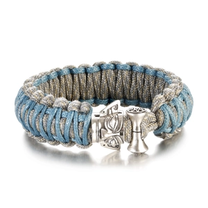 Close-up of handmade paracord bracelet with Nordic style silver metallic buckle detail
