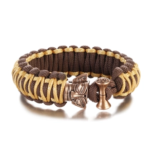 Detailed shot of tactical paracord bracelet featuring an owl head bronze toggle clasp