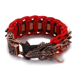 Detailed view of the red and brown paracord bracelet with a bronze dragon head clasp