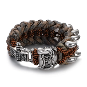 Detail of grey and orange woven men's bracelet with a vintage silver bulldog head charm