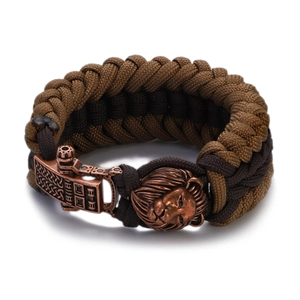 Detail of paracord woven bracelet with lion head charm and Celtic metal clasp