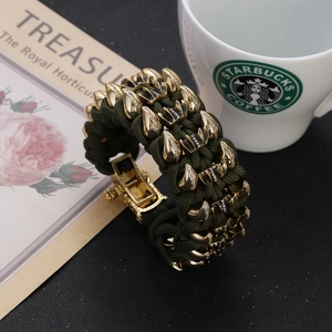 Army green braided survival bracelet with gold claw accents and sparkling crystals