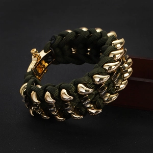 Men's dark green braided paracord bracelet with gold metal claw accents and rhinestones