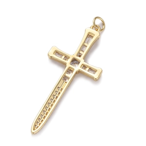 Detailed view of a gold cross sword pendant with inlaid cubic zirconia crystals