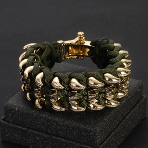 Men's green paracord woven chain bracelet with gold metal accents and sparkling crystals