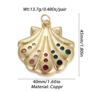 Golden scallop shell pendant featuring colorful round zircons and detailed metal texture