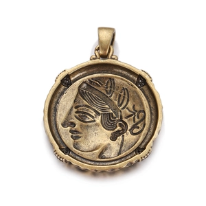 Detailed view of a vintage bronze Roman coin pendant with goddess profile relief