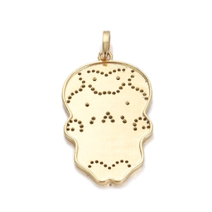 Macro shot of 18K gold-plated skull pendant back view with precise stone setting holes