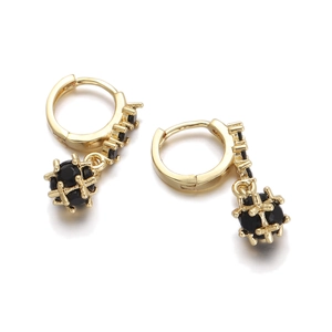Macro detail of 18K gold-plated hoop earrings with black zircon sphere charm drop