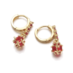 Detailed close-up of 18K gold plated hoop earrings with red zircon stones and hollow balls