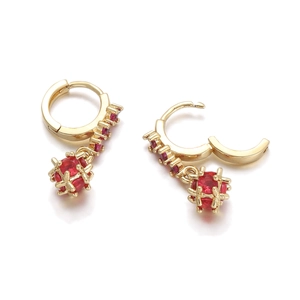 Detailed view of 18K gold plated huggie earrings with red zircon stones and ball pendant