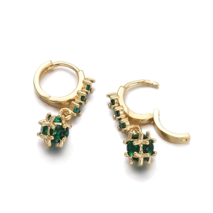 Detailed close-up of 18K gold-plated hoop earrings with green zircon sphere drops