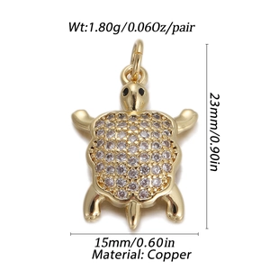 Detailed view of turtle pendant in brass with white cubic zirconia pavé setting