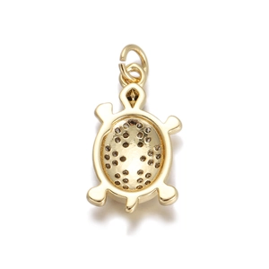 Detailed close-up of golden turtle pendant with honeycomb openwork structure and bale