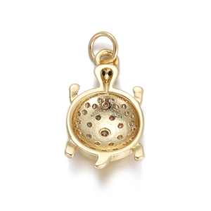 Detailed back view of gold turtle pendant with perforated light holes for zircons