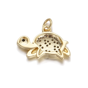 Detail of gold turtle pendant with zircon accents and textured shell for DIY jewelry