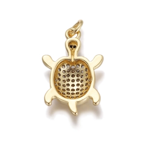 Macro view of the hollow honeycomb structure on the back of a gold turtle pendant