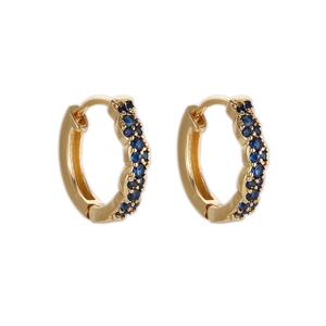Detailed macro shot of gold plated hoop earrings with micro-pave dark blue zircon stones