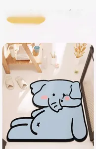 Detailed view of an elephant-shaped light blue cartoon bath mat in a home bathroom setting