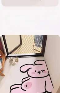 Detail of pink cartoon rabbit diatom mud bath mat with absorbent non-slip texture