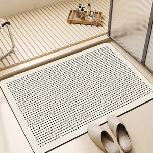 Minimalist beige bathroom rug with geometric stripe pattern in a modern shower room