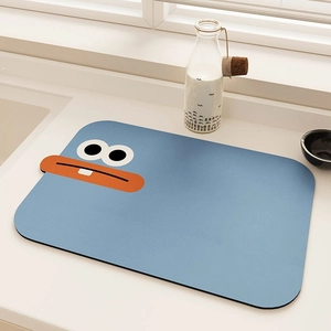 Detail of light blue kitchen drainage mat featuring a cartoon duck on a clean countertop