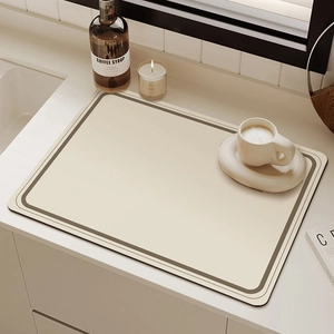Detail of cream-colored absorbent drying mat with coffee cup and sleek black border