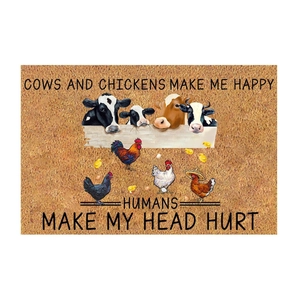 Detail of farm-themed door mat with cow and chicken graphics and humorous slogans