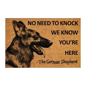 Macro detail of coconut fiber doormat featuring German Shepherd sketch and quote