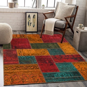 Detailed retro bohemian patchwork carpet with ethnic patterns on a dark wooden floor