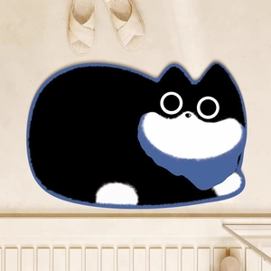 Cute black cat shaped bath mat with big eyes on light wood floor with slippers