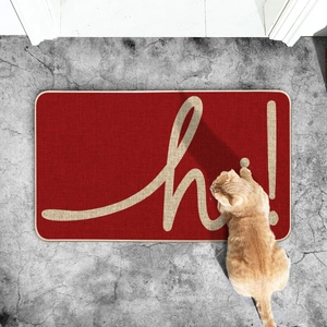 Modern red entrance doormat with 'hi!' lettering and a tabby cat on a gray floor