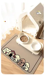 Absorbent diatom mud pet feeding mat with cute puppy design and dual bowls on wooden floor