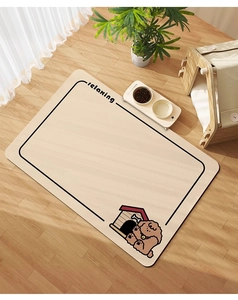 Detail view of cartoon dog diatom mud pet mat with doghouse illustration on wood floor