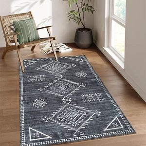 Detail of grey geometric cashmere-style rug on light wood floor with Nordic decor