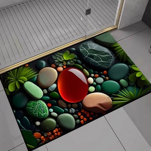 Detail der 3D-Kieselstein-Badematte mit tropischen Blättern auf grauem Fliesenboden