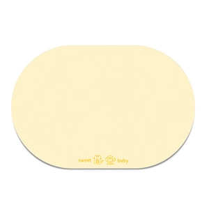 Detail of oval cream pet feeding mat with smooth leather texture and cat motif