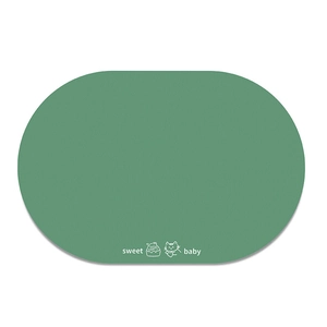 Detail of green diatom mud pet mat featuring non-slip texture and sweet baby print