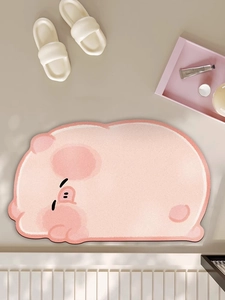 Close-up of pink cartoon pig bathroom mat with soft absorbent surface and anti-slip backing