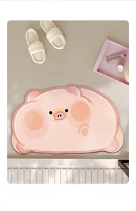 Close-up of pink pig shaped bath mat with soft plush texture and non-slip surface