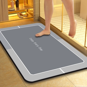 Absorbent diatomite bath mat with Enjoy Every Day text and non-slip grey design