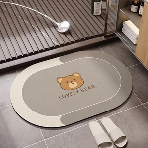 Detail of absorbent diatom mud bathroom mat featuring a cute cartoon bear illustration