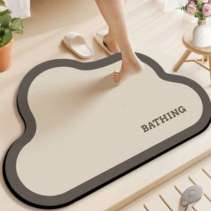 Close-up of cloud-shaped bathroom mat with Bathing text and anti-slip gray edge