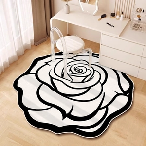 Irregular camellia diatom mud rug with black and white floral pattern for bedroom decor