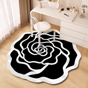 Detailed close-up of a camellia shaped black and white non-slip diatom mud floor mat